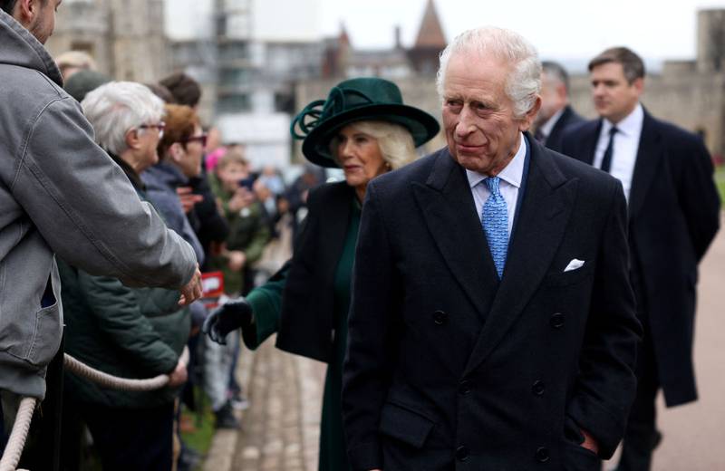 WINDSOR, ENGLAND - MARCH 31: King Charles III and Queen Camilla greet people after attending the Easter Mattins Service at Windsor Castle on March 31, 2024 in Windsor, England. (Photo by Hollie Adams - WPA Pool/Getty Images)